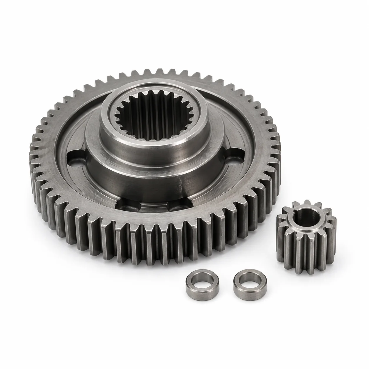 Hardened steel UAV servo output gear with internal spline, matching pinion and spacers on a white background