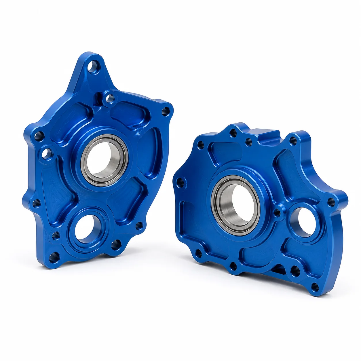 Blue anodized lightweight UAV servo side plates with precision bearing bores and mounting holes on a white background